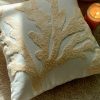 Machine embroidered cushion cover.