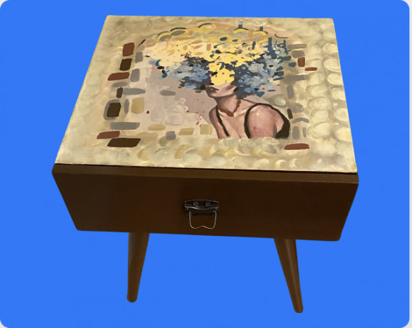 Wooden side table with a drawer