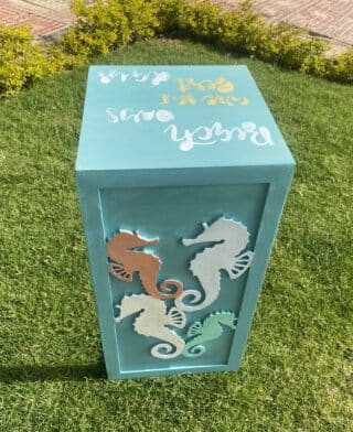 Wooden sofa side table with sea horses collection