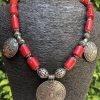 Natural Red Coral Necklace with Siwa Oasis Silver Charms - Handcrafted Artistic Masterpiece . "عقد مرجان أحمر طبيعي مزين بدلايات من تراث واحة سيوة - تحفة فنية يدوية"