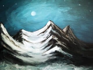 moonlight shining on snowy mountains