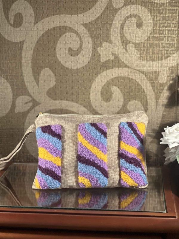 Colored tufted jute clutch