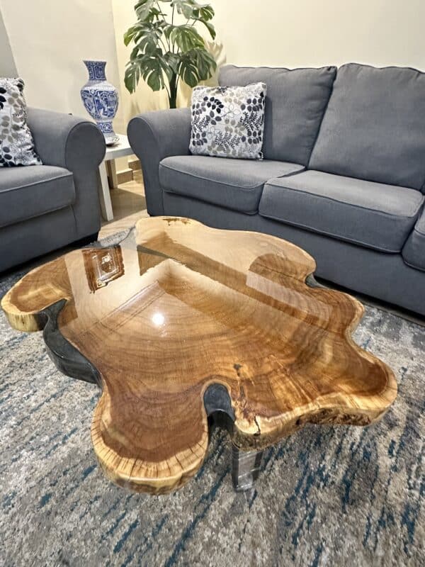 live edge couch table with cracks filled with grey epoxy