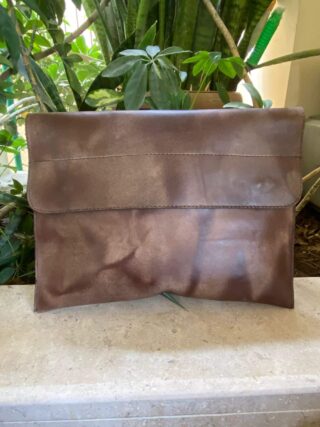 This slim Leather Laptop Sleeve is made of a soft natural pullup leather with one extra pocket that accommodates smaller necessities.