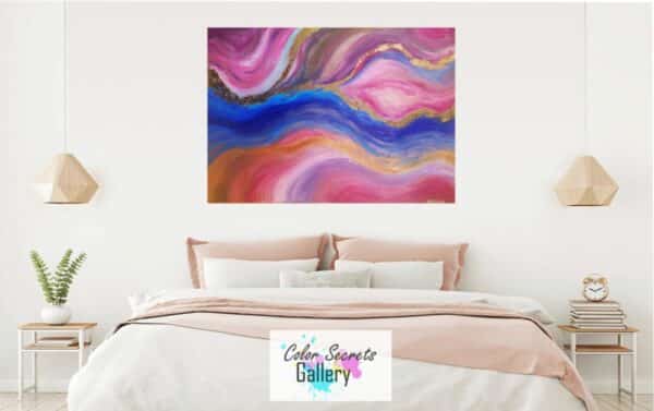 staged abstract painting in pink blue and gold