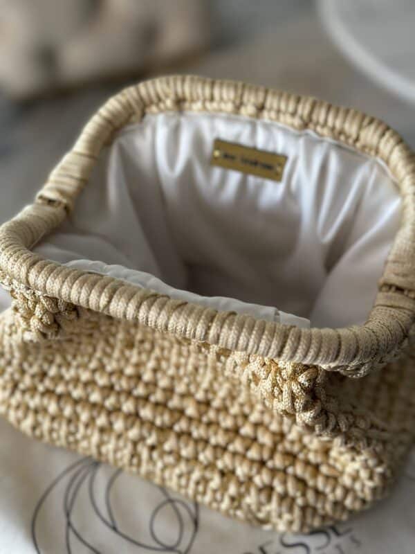 Ivory colored bag with a touch of gold