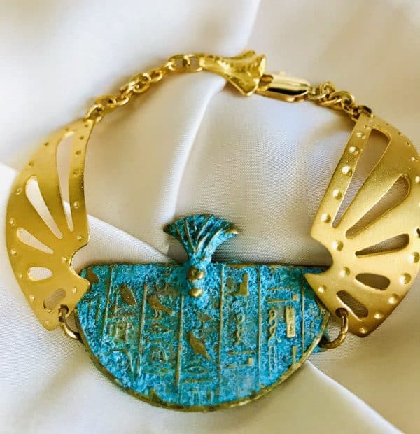 Blue rust pharaoh cuff with goldplated Isis wings on the sides the