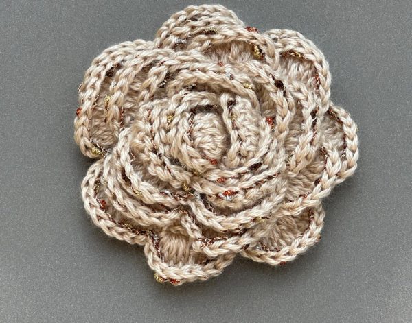 Creamy rose crochet brooch with glittery borders