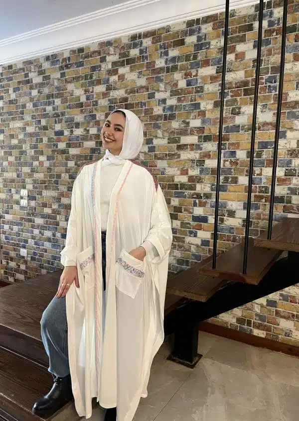 Off white velvet kaftan with pink byte touch .