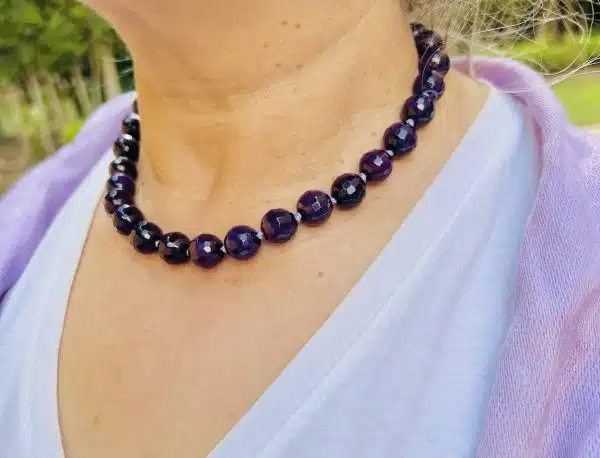 Hand knotted amethyst necklace , sterling silver clasp
