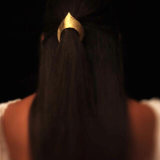 The Angel brass headpiece, not gold plated.