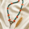 Bluerust lotus necklace with coral chips