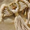 Gold and white macrame Christmas angel.