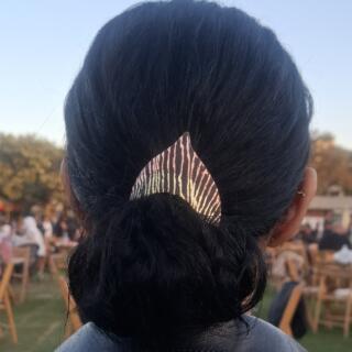 The Angel Tweak headpiece, copper over brass, oxidized to black, hand-scratched to reveal the metal layers beneath.