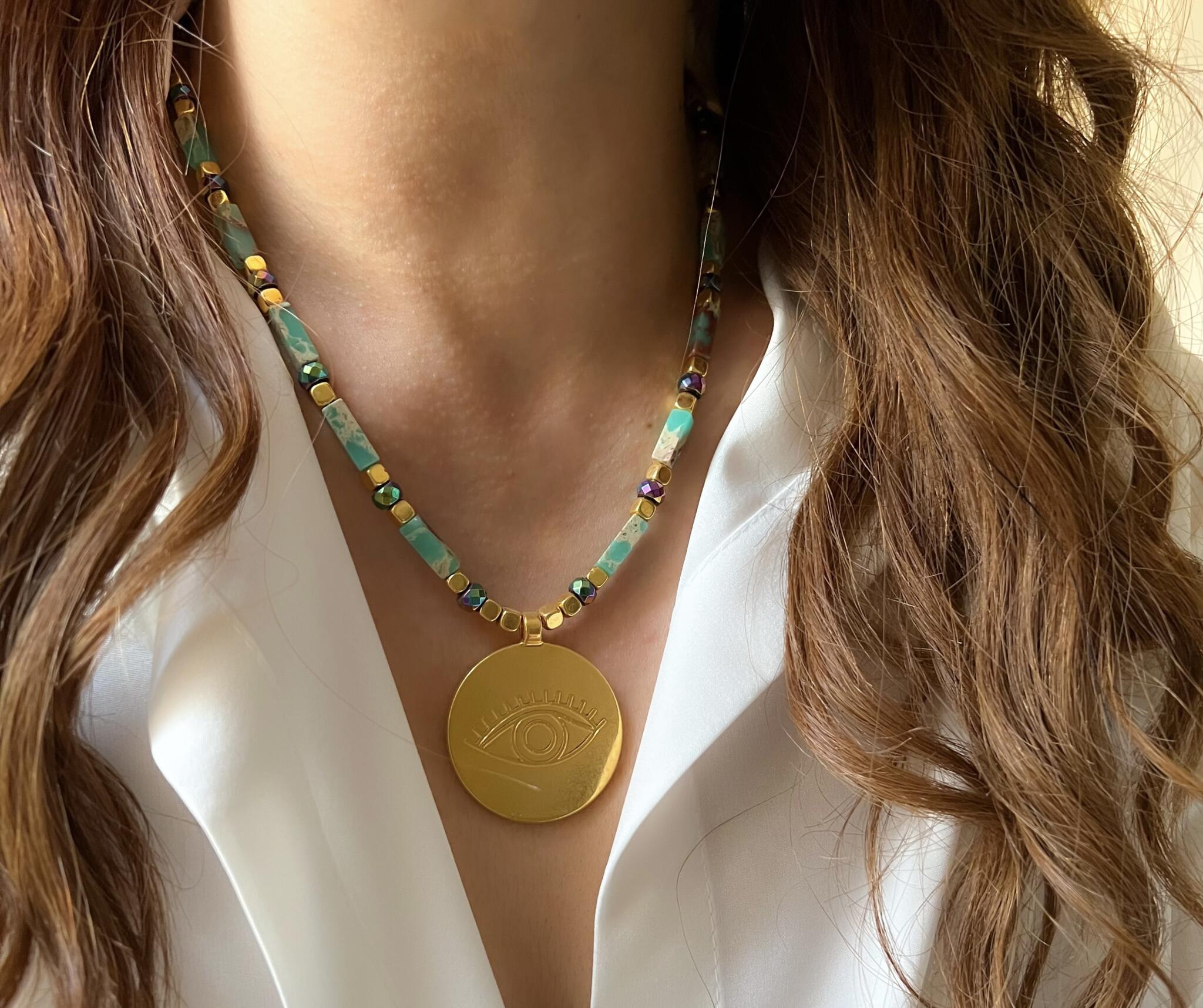 Golden evil eye necklace 3 FAD3FF8E F7D1 4DD4 85B0 F097754A2ABE scaled