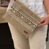 Beige beach clutch with a touch of olive