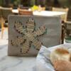 Beige clutch with crochet flower