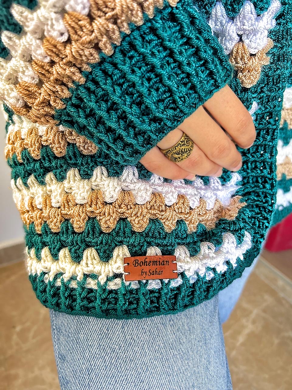 Teal Striped Crochet Cardigan 3 Handmade striped crochet cardigan in teal, white, and beige with a cozy oversized fit.