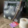 Golden eyes black Handel clutch
