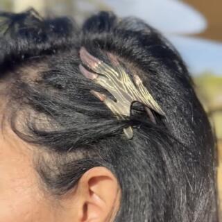 The Flame Tweak headpiece, copper over brass, oxidized to black, hand-scratched to reveal the metal layers beneath.