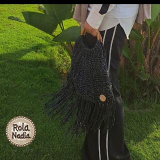 A Trendy Black and Silver BAG With Wooden hand