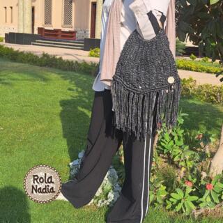 A Trendy Black and Silver BAG With Wooden hand