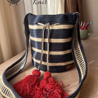 Handmade navy blue tapestry bag with off-white stripes, crochet Mochila style, well-crafted and unique.