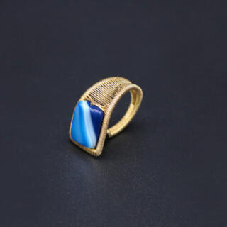 Brass ring with blue agate gemstone.