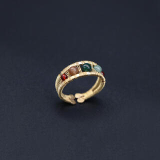 Brass ring with moss agate gemstones