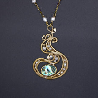 Brass necklace with pearls and abalone shell.
