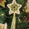 Green and white macrame Christmas tree star.