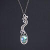 Silver necklace with abalone shell and silver balls.