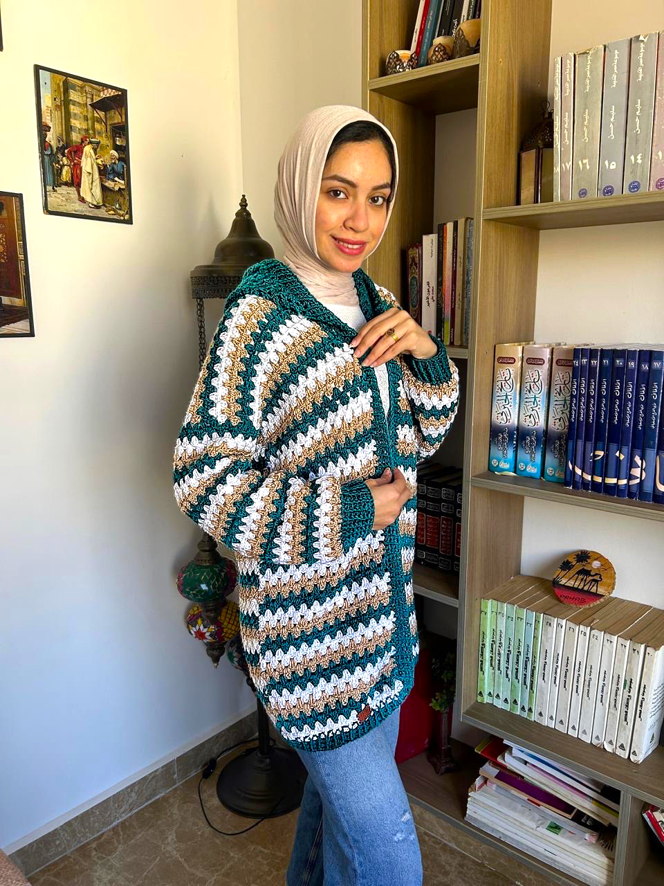 Teal Striped Crochet Cardigan 1 Handmade striped crochet cardigan in teal, white, and beige with a cozy oversized fit