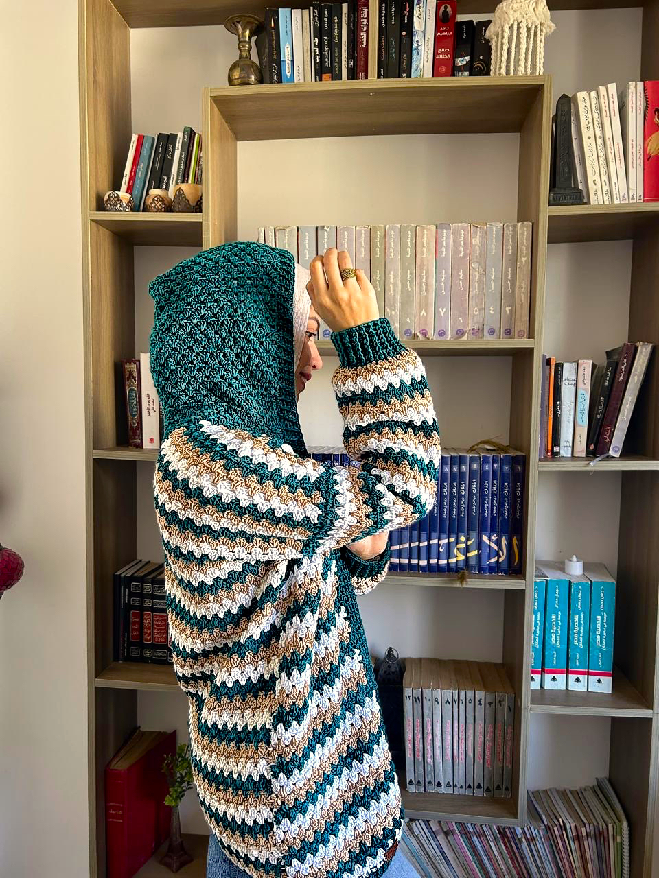 Teal Striped Crochet Cardigan 2 Handmade striped crochet cardigan in teal, white, and beige with a cozy oversized fit.