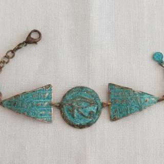 Horus eye with vintage triangle bracelet.