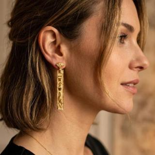 Gold plated hieroglyphic drop earrings.