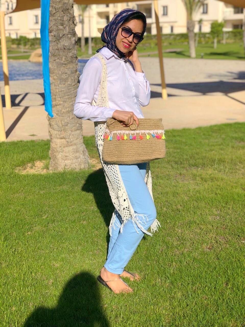 Boho Breeze Handmade Bag 5 Handmade crochet shoulder bag in beige with colorful woven details and tassels, featuring a long multicolor strap and a relaxed boho-inspired design.