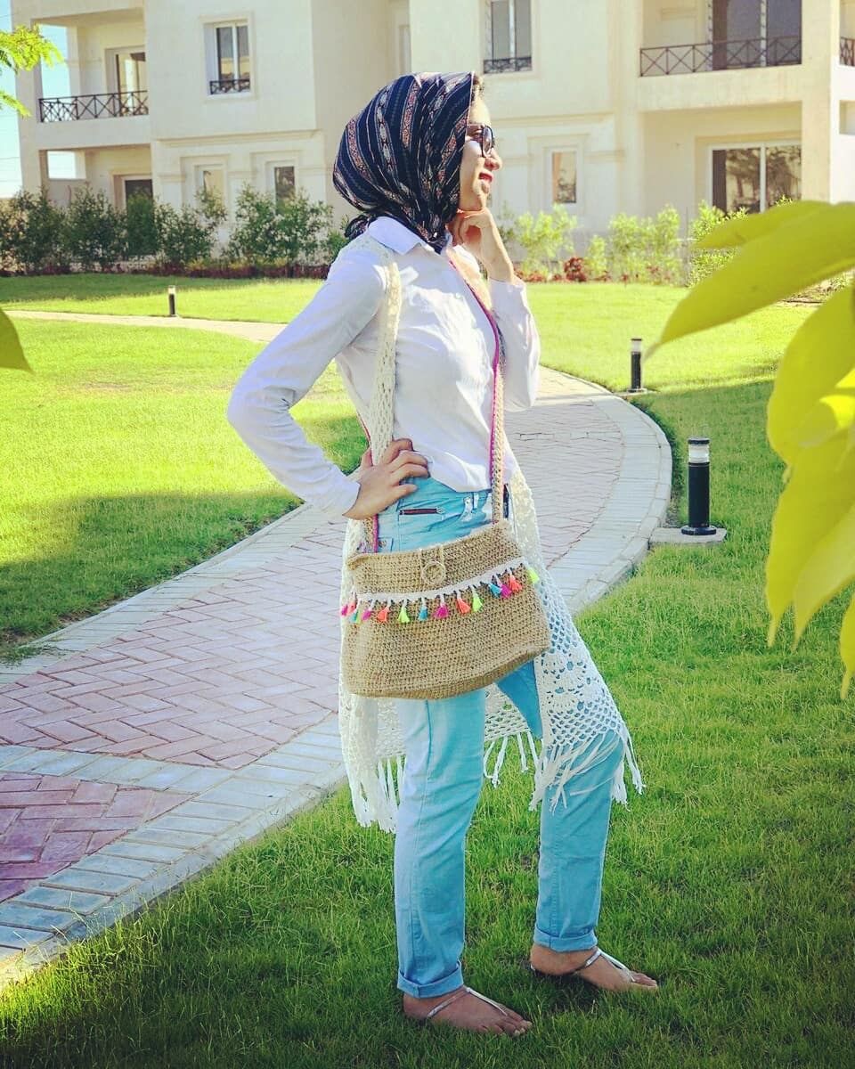 Boho Breeze Handmade Bag 3 Handmade crochet shoulder bag in beige with colorful woven details and tassels, featuring a long multicolor strap and a relaxed boho-inspired design.