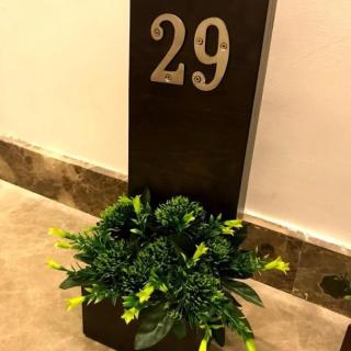plain door sign with artificial floers