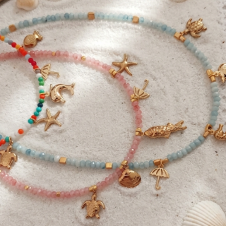 Tiny stones with sea world goldplated charms