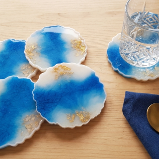 Blue and off white resin coasters with gold leaves