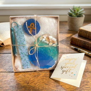 package with shell beach coaster, a bookmark and a pharaonic magnet