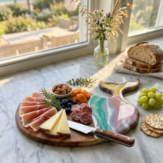 Whale shaped charcuterie board with colorful resin waves