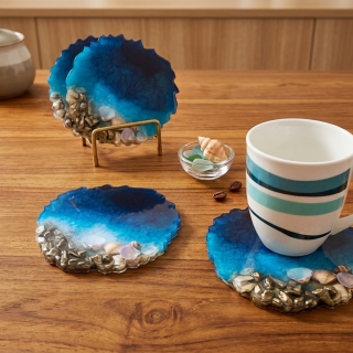 dark blue beach with shells and stones resin coasters