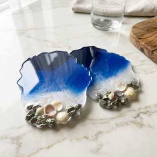 Dark blue beach with shells and stones