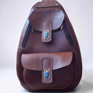 A Natural Leather Sling Bag with Copper Ancient Egyptian Scrabe