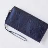 A Pull-Up Leather Wallet/Clutch with Embossed Floral Pattern