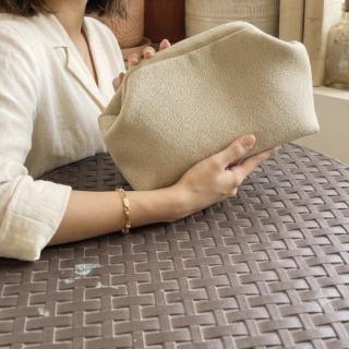 Giltery beige clutch